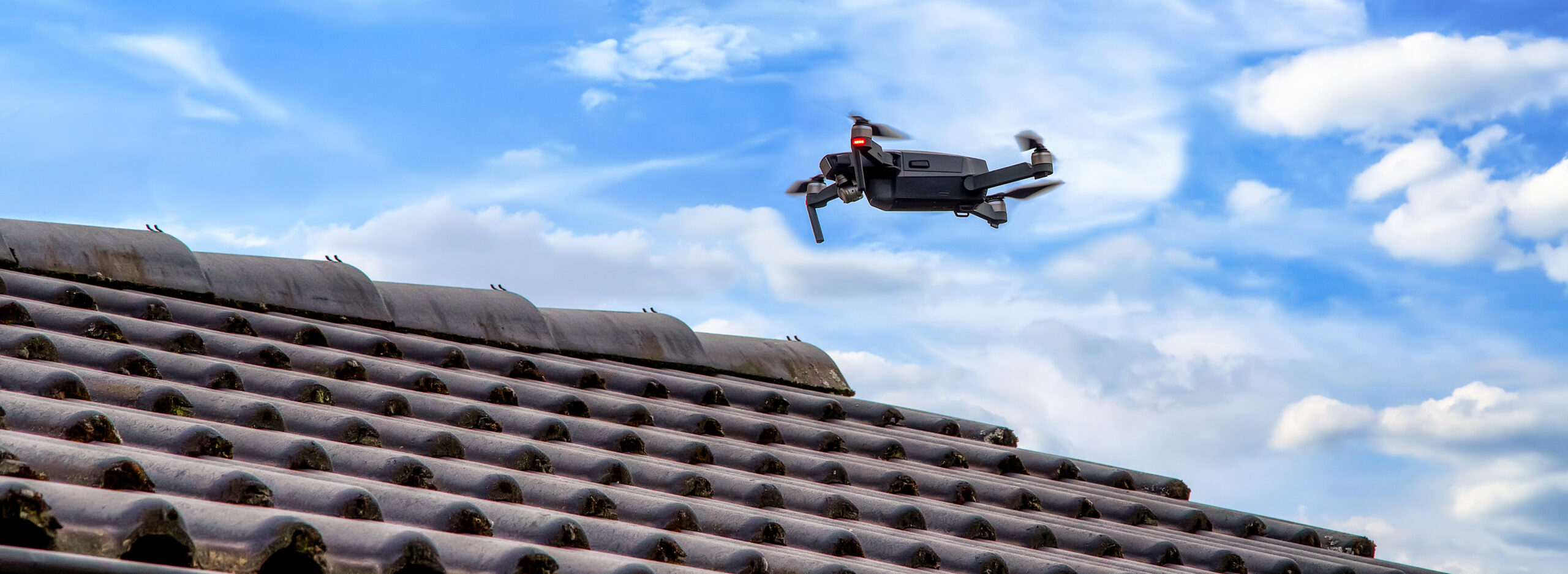 Drone Roof Inspection - Drone Flying over tile roof